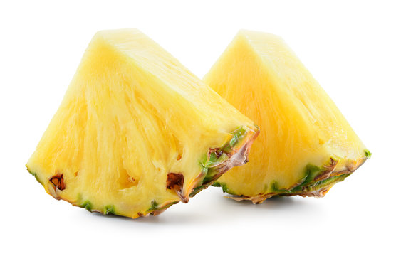 Pineapple. Slices isolated on white background. Fresh raw triangle chunks of fruit. Full depth of field.