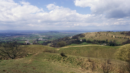 England, Cotswolds, Gloucestershire, view from Birdlip Hill towards Crickley Hill Country Park, the Severn Vale and Gloucester