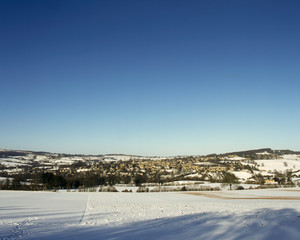 England, Gloucestershire, Cotswolds, winter view of Painswick in snow