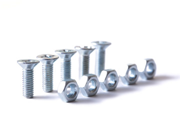 Винт с гайкой на белом фоне. Изолят. The screw with a nut on a white...