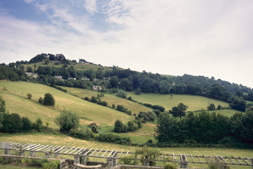 England, Cotswolds, Gloucestershire, view up to Rodborough Common with Rodborough Fort hidden by trees