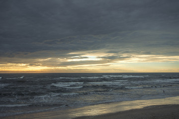Sunset on the sea from sand beach on the Curonian spit