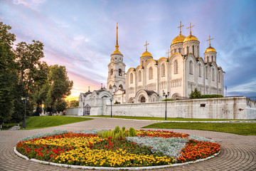 Uspenskiy cathedral on sunset with flowerbed on foreground in Vladimir, Russia