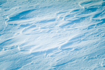 Beautiful fresh snow pattern in minimalistic style. Winter background. Norway, Northern Europe. Close up texture