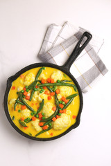 Indian Vegetarian curry Vegetable Korma. Copyspace, top view
