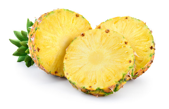 Pineapple isolated on white background. Ripe half and round slices of fruit with leaves. Full depth of field.