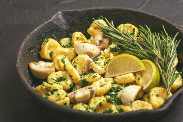 Italian Gnocchi with cream sauce, olives and rosemary