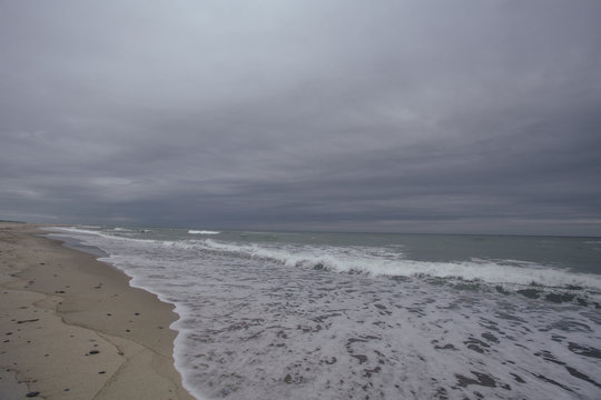 Storm on the see with  waves on the sand beach