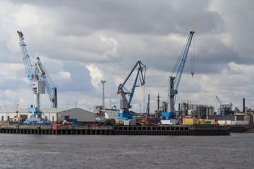 Fototapeta na wymiar Containers, docks and cranes in the port of hamburg