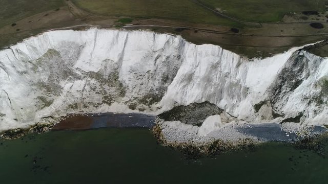 Aerial footage of The White Cliffs of Dover are cliffs that form part of English coastline facing the Strait of Dover they are part of the North Downs formation and cliff face has striking appearance