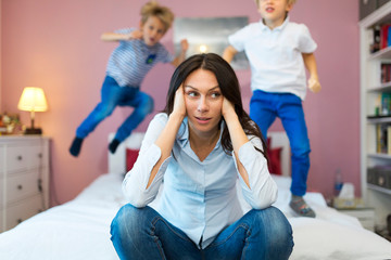Frustrated mother with children 
