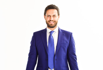 Businessman with smiling face wears classic suit and tie.