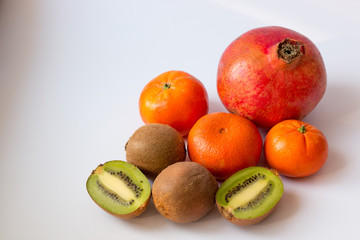 tropical fruits on white table