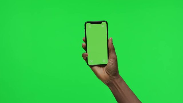 Female Hand holding Green Smartphone Still