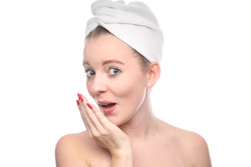 Beautiful young woman in towel after shower on white background