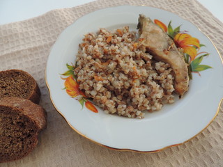 fried fish with buckwheat and tomatoes