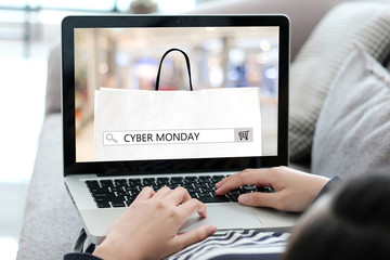 Woman hands typing laptop computer with cyber monday sale on search bar banner background, Online...