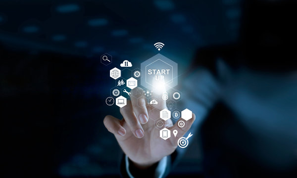 Startup concept. Businessman touching icon start up and icon network connection on modern virtual interface