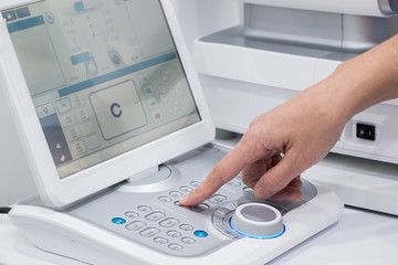 doctor oculist at work. diagnostic ophthalmologic equipment. medicine concept