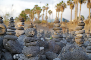 Fototapeta na wymiar Several pebbles stacked up in a beach