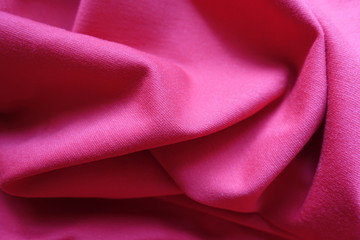 Folded simple deep pink viscose jersey fabric