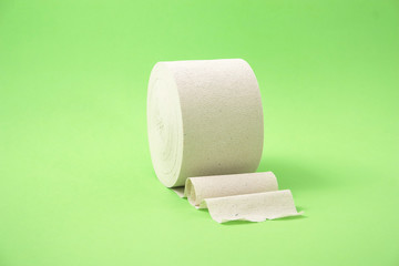 roll of toilet paper on a green background.