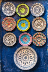 A selection of handmade dishes for sale outside shops in the artisan area of Essaouira in Morocco