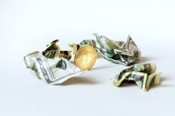 Bitcoin among the crumpled bills of dollars.