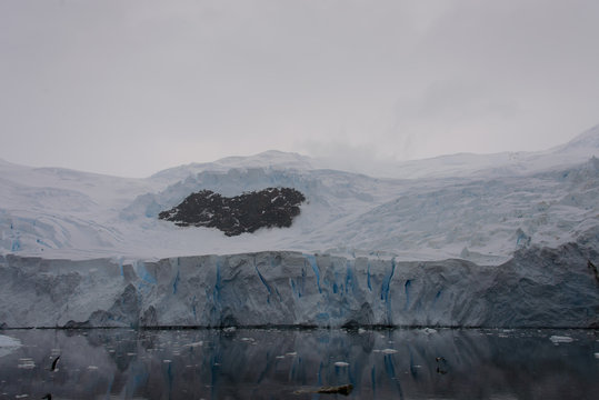 Antarctic beach with glacier