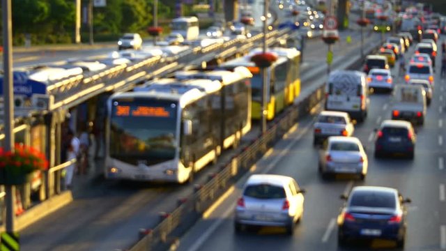 Out of focus, Time Lapse. Istanbul top spot in traffic congestion index in 2014. Currently almost 1.8 million automobiles choke its roads. Incirli Metro Bus Stop with yellow buses