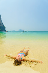 woman resting at the  tropical Thailand Railay beach
