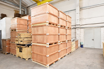 Large and light warehouse, cargo storage in wooden boxes