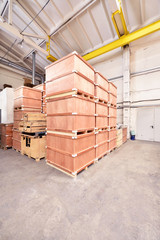 Large and light warehouse, cargo storage in wooden boxes