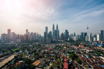 Fototapeta na wymiar Cityscape of Kuala Lumpur Panorama at morning. Panoramic image of skyscraper at Kuala Lumpur, Malaysia skyline at sunrise.