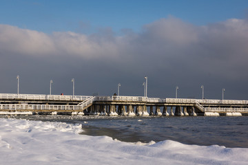 Fototapeta na wymiar Pier on the Baltic sea at winter in Sopot, Pomorskie, Poland