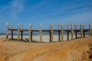 Destroyed wooden bridge in Praia da Bordeira beach near Carrapateira, Portugal.