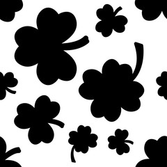 Seamless pattern with black clovers on white background. Vector illustration