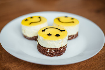 cake with a smile lies on a plate