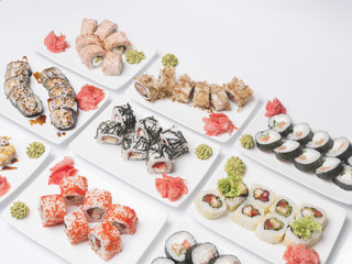 set of sushi rolls, on white background, top view
