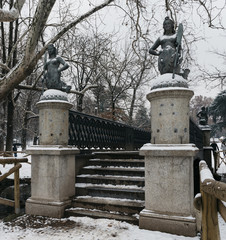 Fototapeta premium Mermaids bridge at Sempione Park in Milan, Italy. The four mermaid statues on the Ponte delle Sirenette in Milano during the winter.