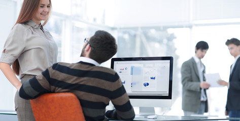 employees analyze marketing scheme