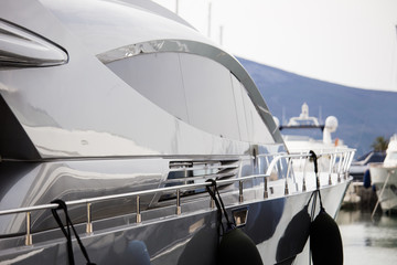 Luxury yachts moored to the pier in the marina