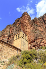 Fototapeta na wymiar Mallos de Riglos mountain and church in Spain.