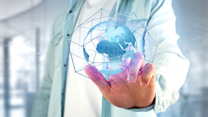 Businessman holding a Connected network over a earth globe concept on a futuristic interface - 3d rendering