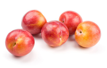 Fototapeta na wymiar Five plums red orange isolated on white background.