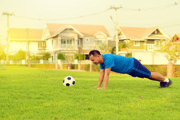 Asian man exercise in garden
