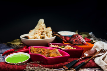 Traditional Indian food chicken tandoori and Tikka with garlic naan