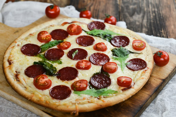 Tasty Pizza With Tomato Sauce, Pepperoni Sausage, And Mushrooms On Wooden Background Natural Rustic, A Pizza Cutter And Ingridienty.