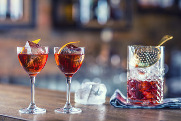 Manhattan cocktail drink decorated on bar counter in pub or restaurant.