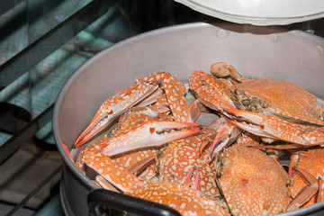 Steamed crabs in the steamer on Hot Smoke Background